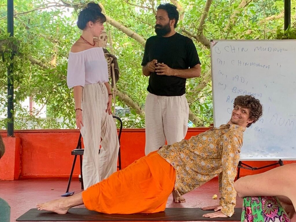 hatha yoga adjustment classroom scene devvrat yoga sangha kerala
