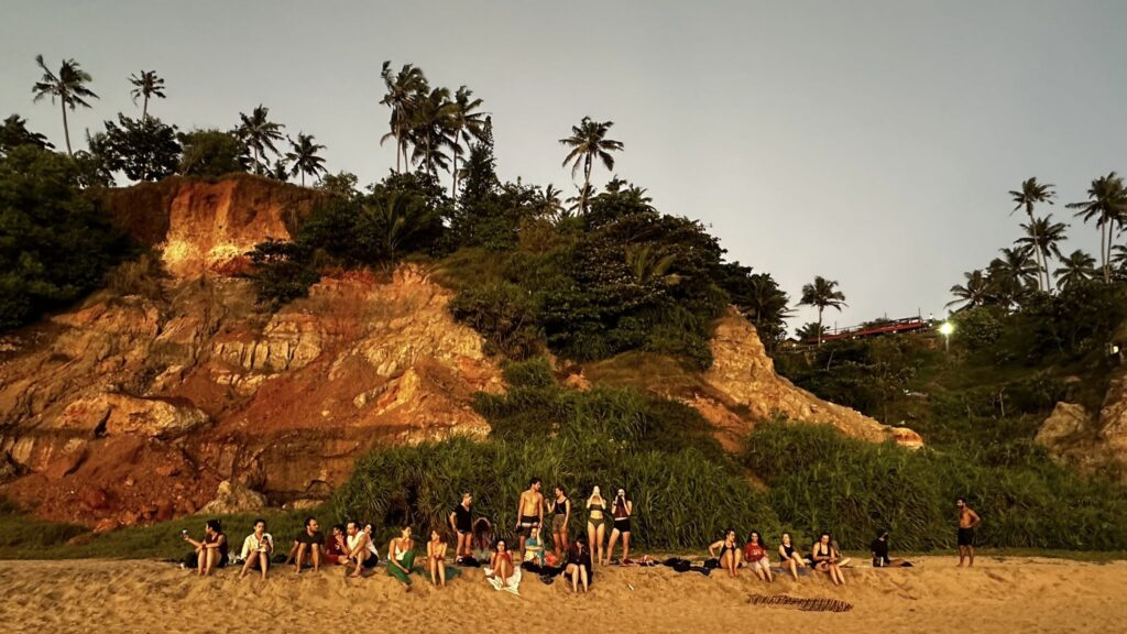 sunset-beach-gathering-yoga-students-varkala-kerala-devvrat-yoga-sangha