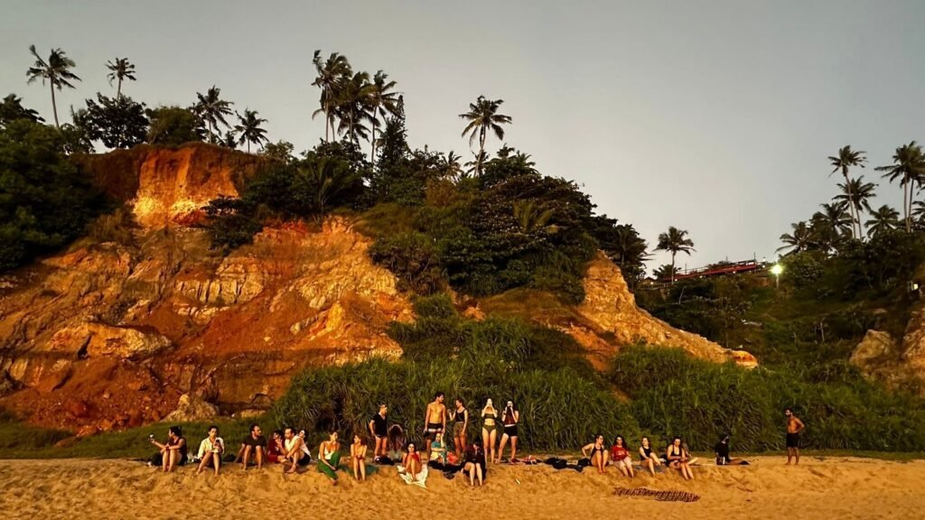sunset beach gathering yoga students varkala kerala devvrat yoga sangha