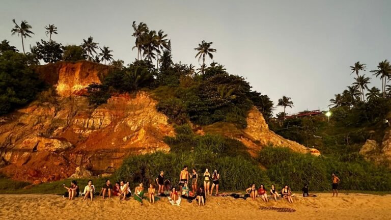 sunset beach gathering yoga students varkala kerala devvrat yoga sangha
