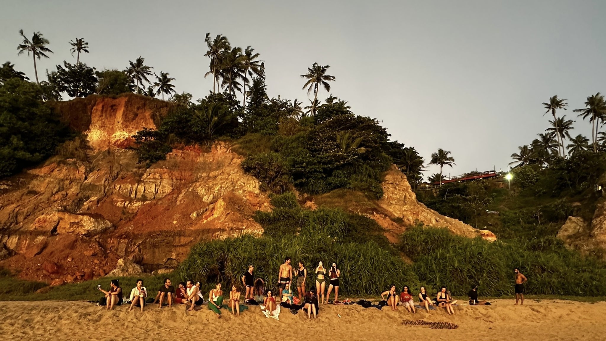 sunset-beach-gathering-yoga-students-varkala-kerala-devvrat-yoga-sangha
